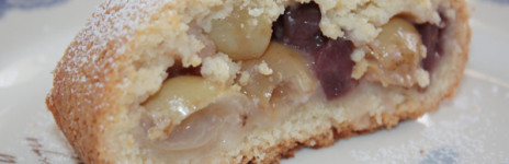 Strudel soft pastry with grapes, pears and cherries in syrup